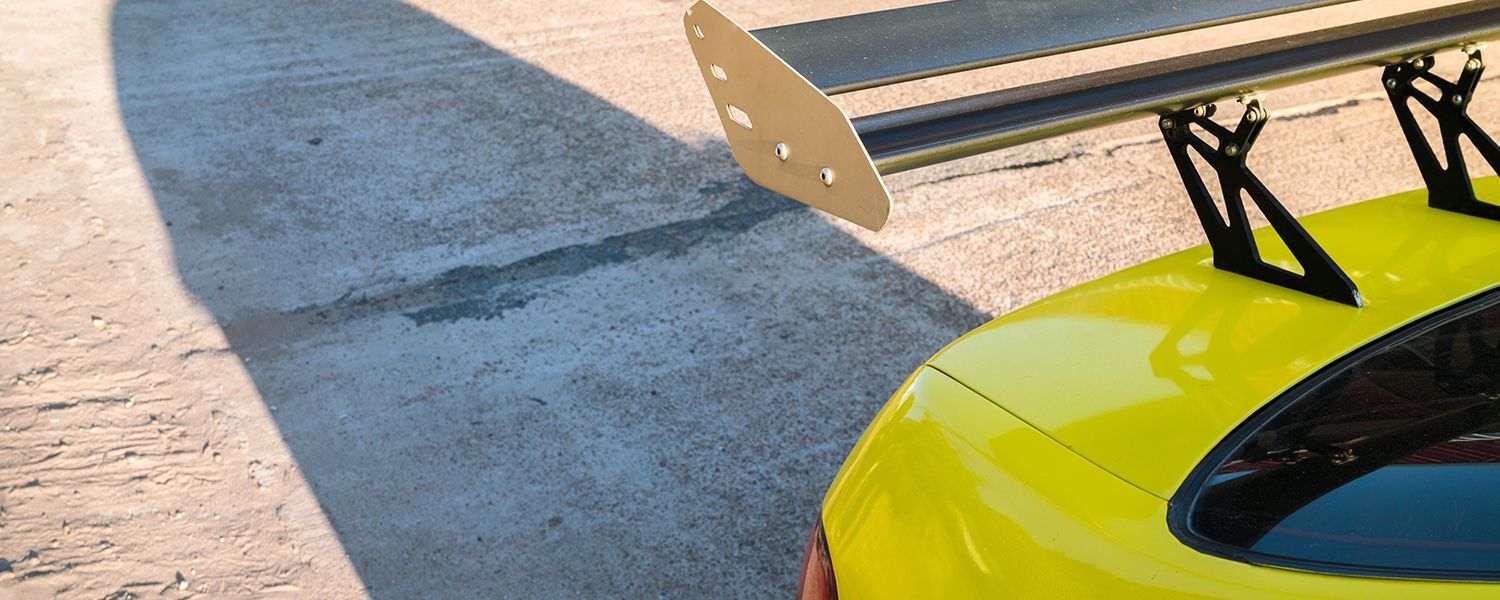 Modified vehicles: Close-up of a yellow car with a modified bumper.