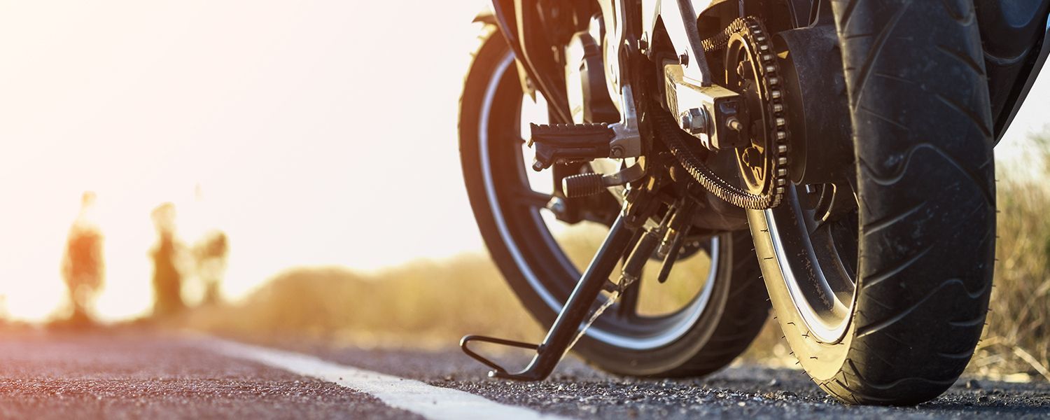 Motorbike insurance: A parked motorcycle by the side of the road.