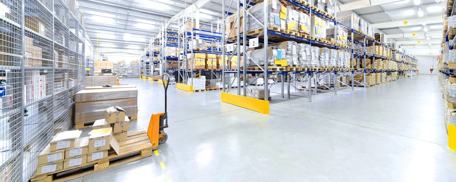 Warehouse insurance: The inside of a vast and empty warehouse.
