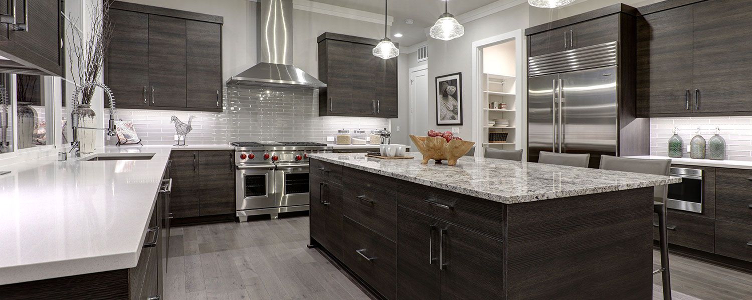 Kitchen and bathroom showroom insurance: Inside of a silver and darkbrown kitchen. 